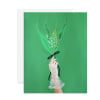 Hand holding a small lily-of-the-valley bouquet on a green card