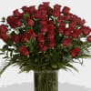 Bouquet of red roses in a clear glass vase