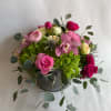 Experience a burst of vibrant colors with our stunning flower arrangement, featuring