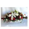 A Holiday arrangement with red roses, orchids, hanging amaranthus, stargazer lilies, dianthus