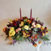 This centerpiece is long and short, perfect for any dinner table, with
