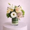 A lush and romantic floral arrangement featuring an exquisite blend of roses