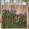 Burlap tote bag with embroidered wildflowers in purple, blue, and yellow