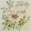 Sympathy enclosure card featuring a white flower with greenery. A special touch