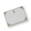 A white and pale green gift box with a decorative logo