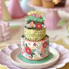 Tiered birthday card with floral decorations on a plate