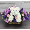 White floral teddy bear in a basket with pink and purple flowers