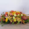 This fall favorite is one-of-a-kind, featuring a glorious autumnal roses, orchids, tulips