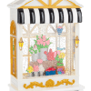 Decorative flower shop display with colorful potted blooms in a miniature storefront