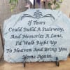 A memorial stone plaque with a sympathy quote on a stand.