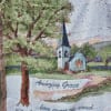 Woven blanket with a church scene and the words "Amazing Grace"