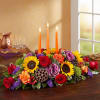 Colorful centerpiece for your Thanksgiving table with 3 candles
includes, roses, cabbage, sunflowers