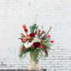 Beautiful mix of holly, peonies, and Christmas greens. Perfect for the Season!'

pictured
