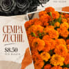 Bunch of bright orange cempasuchil marigolds with a price sign