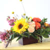 Send this beautiful display of signature autumn blooms as the seasons change