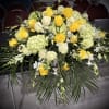 Yellow and white rose arrangement with hydrangeas and greenery