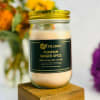 Pumpkin ginger spice candle in a glass jar with a gold lid