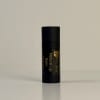 Black lip balm tube labeled Natural Lip Balm Peppermint