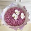 Round bouquet of pink roses with three white orchids