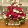 Rustic wooden box filled with beautiful roses, mums, mini cards and much
