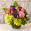 A lush jewel-toned mix of perfect peonies, anemones, ranunculus, hyacinth and hydrangeas.