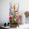 Tall mixed flower arrangement in a wooden box with yellow calla lilies and pink gerberas