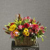 Colorful mixed flower arrangement in a wicker basket