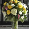 A large arrangement of premium flowers.  May be similar to picture