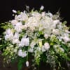 White floral spray with lilies, roses, and hydrangeas