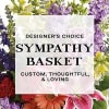 Sympathy basket sign surrounded by colorful flowers