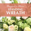 Standing wreath with pale flowers and greenery