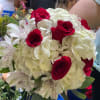 Bouquet of red roses and white hydrangeas with white alstroemeria