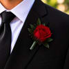 Red rose boutonniere pinned to a black suit jacket