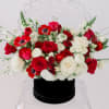 Red and white rose bouquet in a black hat box