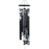 Black metal wind chime with floral pattern and script text on the tubes