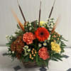 Sweet, warm, and perfectly seasonal, this arrangement comes in a charming brown
