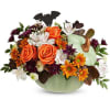 Pumpkin-shaped vase with orange roses and mixed fall flowers