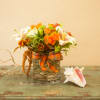 A sweet arrangement of spray roses, lilies, alstroemeria and other autumn colored
