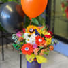 Halloween bouquet with balloons in a purple vase