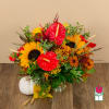 Bright mixed bouquet with sunflowers, red anthuriums, and autumn flowers in a vase