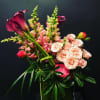 Bouquet with pink calla lilies, peach roses, and snapdragons