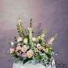 A serene angel in a garden of soft and soothing flowers. Angels