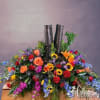 Colorful floral arrangement around a pair of black boots