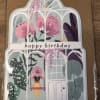 Happy birthday greeting card with greenhouse and woman on a swing illustration
