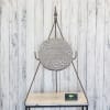 Memorial plaque on a metal stand with paw prints