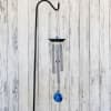 Hanging metal wind chime with blue accents