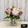 Pink and white mixed bouquet in a clear glass vase