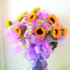1 dozen sunflowers wrapped Hong Kong style, and elegantly arranged in a