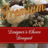 White peony-style flower with pinecones and berries overlaid with Premium Designer's Choice Bouquet text.