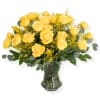 Yellow roses arranged in a clear glass vase